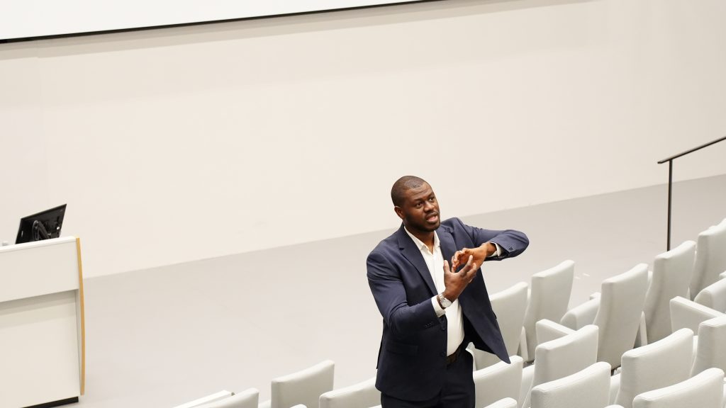 Samuel famolu is speaking as an industry expert to an audience of professionals.